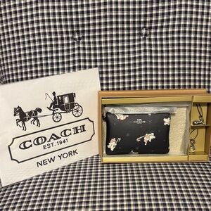 Coach Black Wristlet with Snowman Design and two silver charms